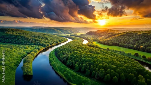 Serene river bends through lush green forests under a vibrant sunset sky