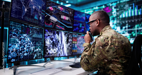 Fotografie Army Soldier Controls CCTV Camera Screen