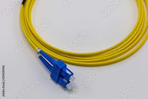 Close Up of Yellow Fiber Optic Cable with Blue Connectors