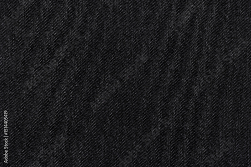 Black denim fabric, for jackets, trousers and other clothes, close-up. Background, texture