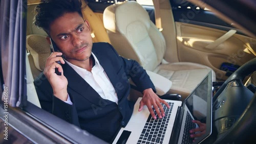 Furious Businessman Work in Car with Laptop and Phone