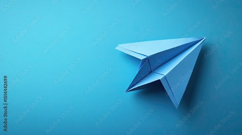 A hopeful blue paper airplane ready for flight symbolizing dreams and new adventures on a solid light blue background in A hopeful blue paper airplane ready for flight symbolizing dreams and new adventures on a solid light blue background in