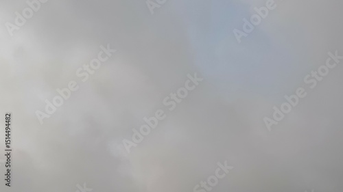 Fototapeta Naklejka Na Ścianę i Meble -  Overcast gray sky fills the frame, creating a soft, atmospheric cloudscape background