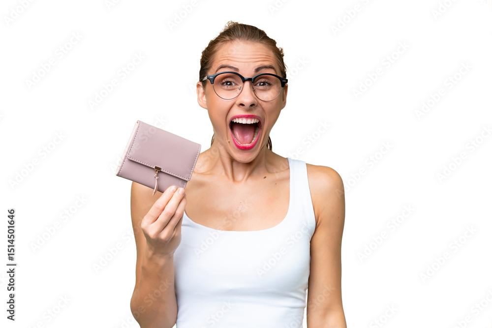 Young caucasian woman holding a wallet over isolated background with surprise and shocked facial expression Young caucasian woman holding a wallet over isolated background with surprise and shocked facial expression