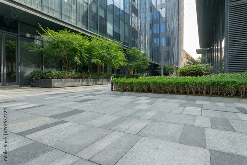 empty road in front of modern office building in the city