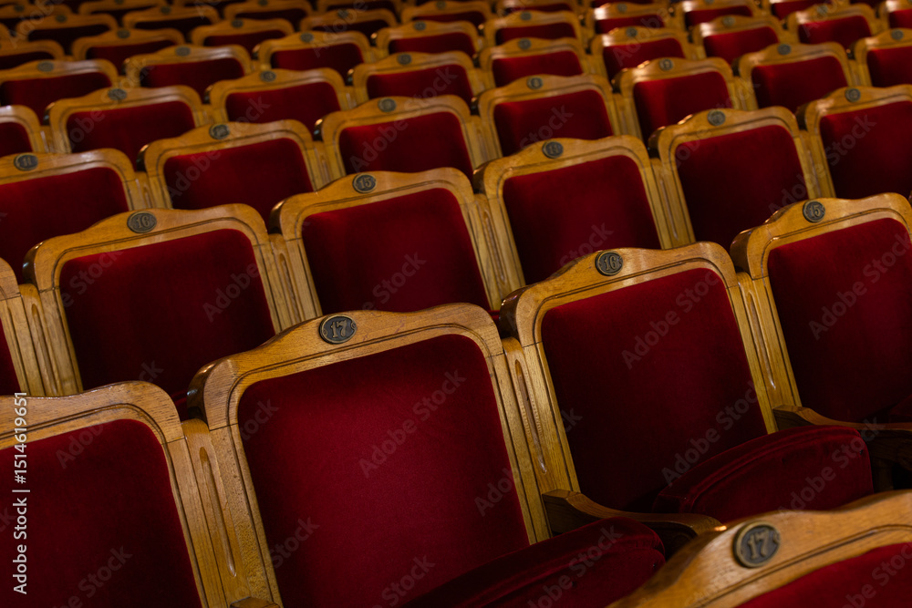 Fototapeta premium Row of red seats in theatre