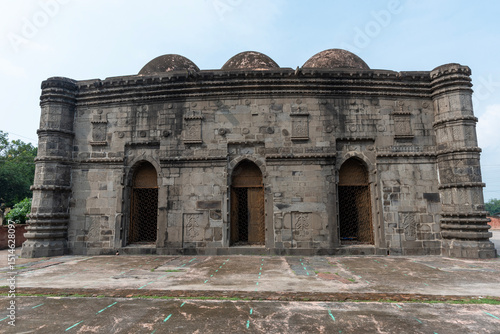 Historic Mosque with Intricate Stone Carvings and Arched Doorways