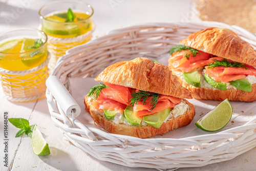 Photos Hot and golden french croissant in summer morning.