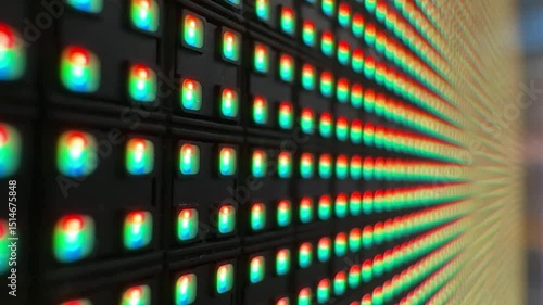 Close-up of an illuminated LED matrix display, showing a grid of blue diodes glowing against a dark background, emphasizing digital technology and modern electronics
