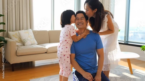 A loving Asian family shares a tender moment at home, daughter kisses father as mother smiles. Captures warmth, happiness, and connection in a bright modern interior.