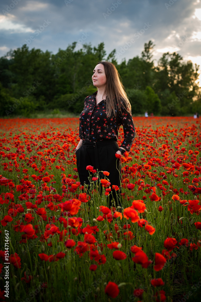Young Woman Smiling in a Poppy Field Young Woman Smiling in a Poppy Field