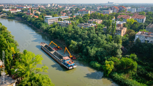 Fotografija Aerial view of river, canal is being dredged by excavators