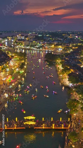 Wallpaper Mural Timelapse, speed montion. Drone view of Hoi An Ancient Town at sunset, bustling with tourists, colorful lanterns, and boats on the river. Perfect for travel, tourism, and cultural visuals Torontodigital.ca