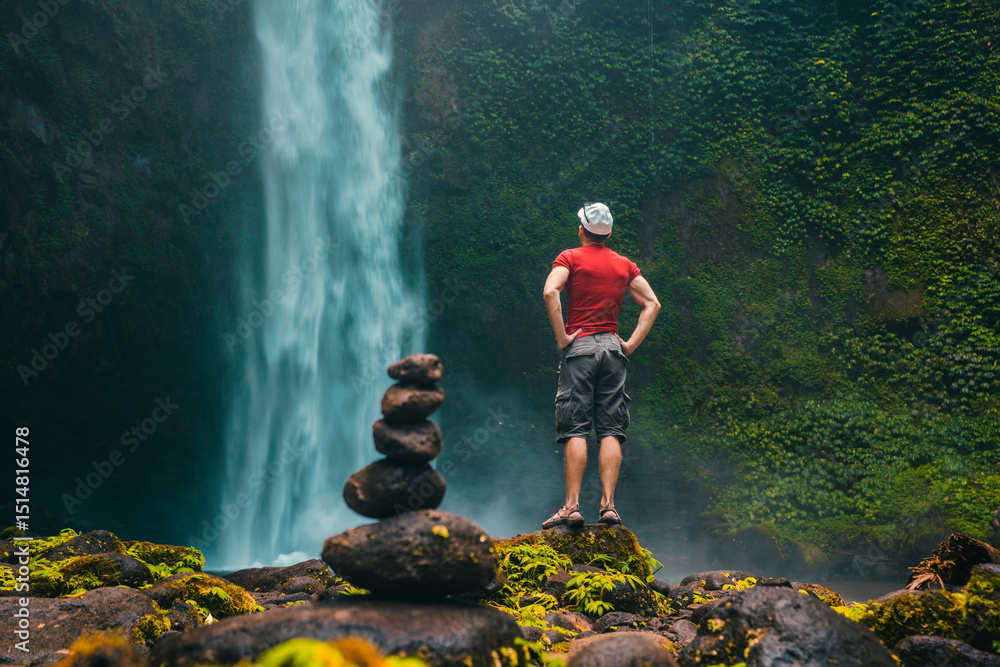 Obraz premium Bali waterfall Air Terjun Nungnung breathtaking 50-meter waterfall in Bali famous landmark and popular travel destinations Bali, Indonesia