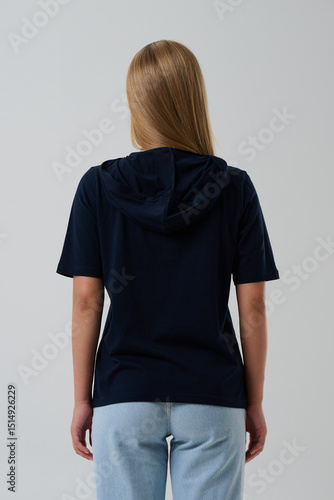 Fotografie Girl model in casual clothes on a gray background posing in the studio