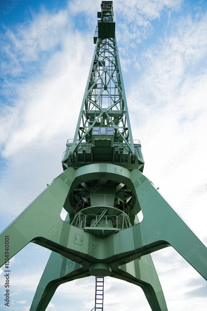 Port cargo crane, close-up, bottom view, vertical photo Port cargo crane, close-up, bottom view, vertical photo