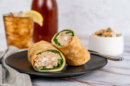 Tuna salad wrap with iced tea and pasta salad 
