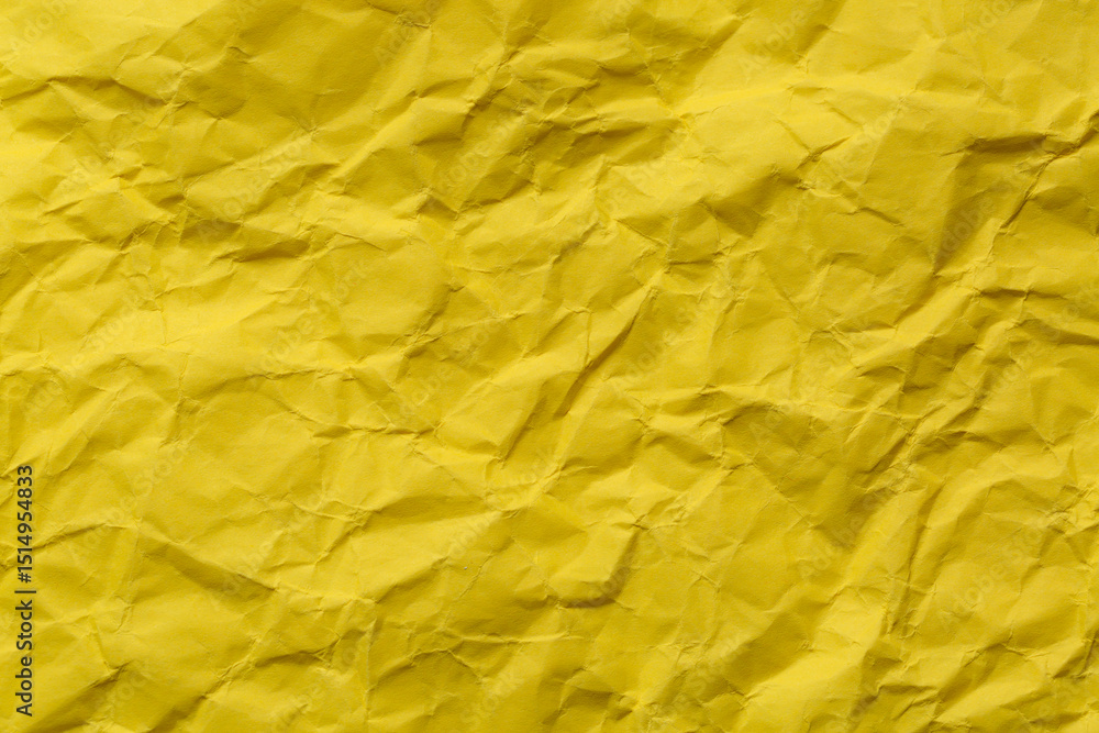 Close-up of yellow crumpled paper background,Macro yellow crumpled paper texture,Macro close up of yellow crumpled paper texture, Crumpled sheet of yellow paper close up. Close-up of yellow crumpled paper background,Macro yellow crumpled paper texture,Macro close up of yellow crumpled paper texture, Crumpled sheet of yellow paper close up.