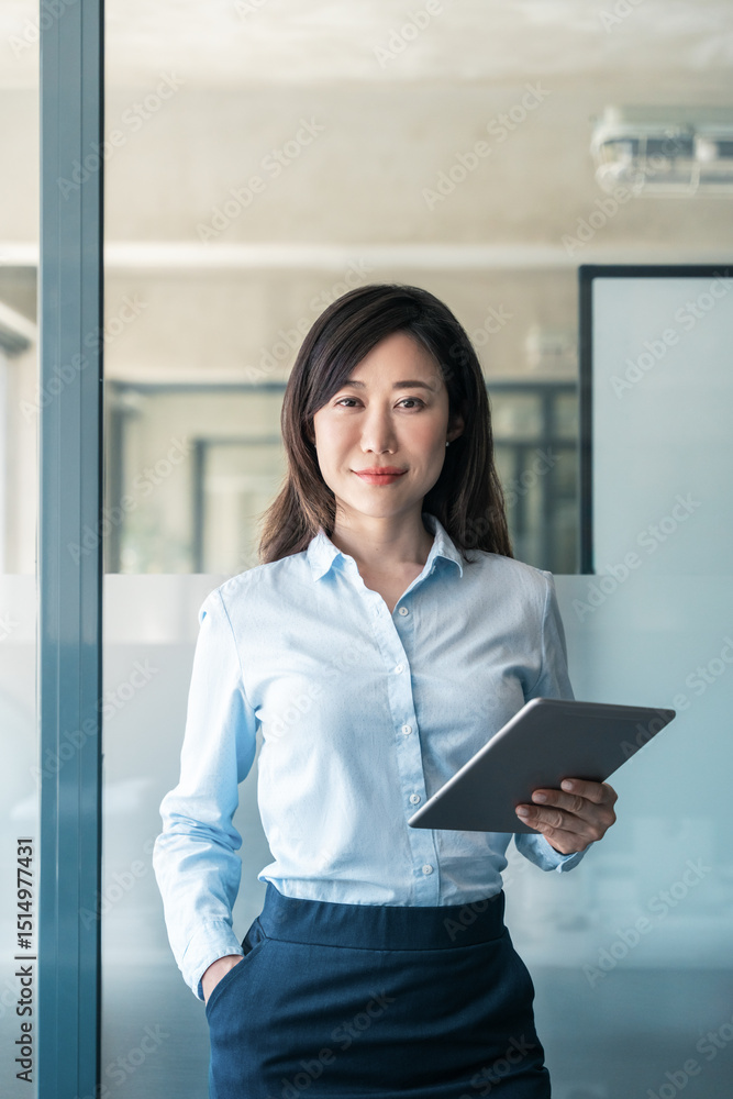 © Stock 4 You - Vertical portrait at camera Asian mature woman ceo analyst manager using tablet for business work. Smiling entrepreneur businesswoman in formal shirt and skirt holding touchscreen pc device in office © Stock 4 You - Vertical portrait at camera Asian mature woman ceo analyst manager using tablet for business work. Smiling entrepreneur businesswoman in formal shirt and skirt holding touchscreen pc device in office