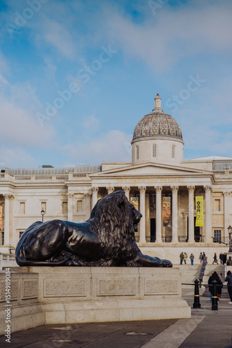 The iconic National Gallery stands prominently in London's Trafalgar Square, its grand Neoclassical façade a beacon for art and history in the heart of the city. photo