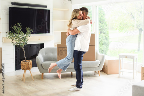 Wallpaper Mural Young couple moving in new home. Couple is having fun with cardboard boxes in new house at moving day. Torontodigital.ca