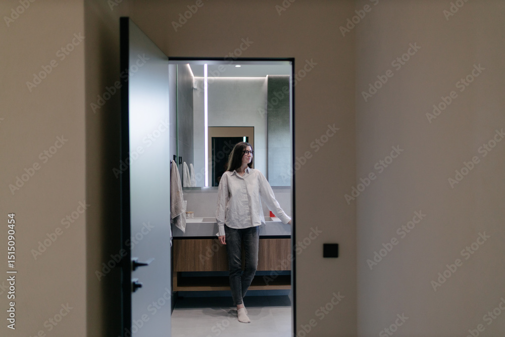 Woman in a modern house interior Woman in a modern house interior