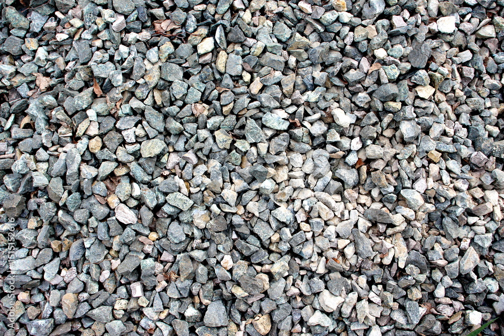 Texture of gray small stones on the ground, top view. Texture of gray small stones on the ground, top view.