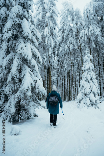 Woman in a snowy Forest