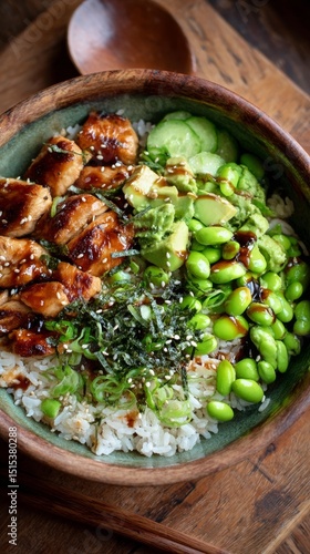 Healthy Bowl With Grilled Chicken, Avocado, and Edamame Served in a Rustic Di...