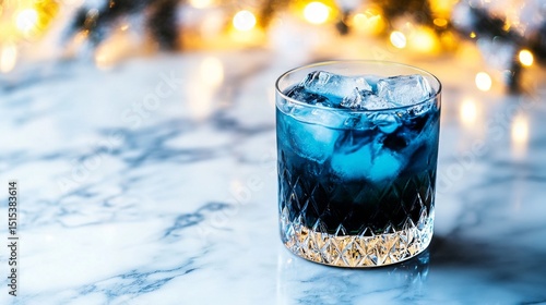 Festive Cocktail With Blue Layers and Ice on a Marble Surface During Winter C...