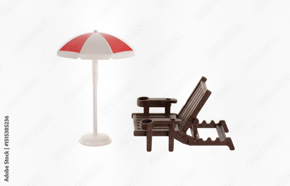toy beach umbrella and toy hammock isolated on white background toy beach umbrella and toy hammock isolated on white background