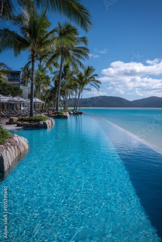 Serene Poolside Oasis Surrounded by Palm Trees and Stunning Ocean Views in a ...