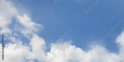 Canvas Print Horizontal bright blue sky with white clouds at the bottom of the background