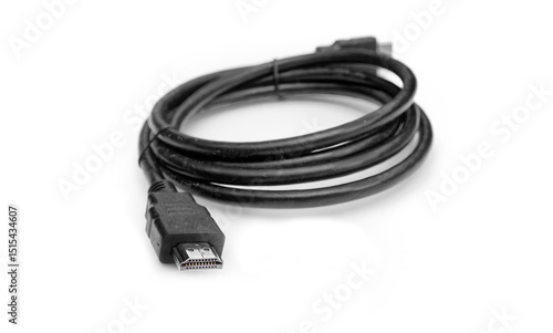 Black hdmi cable coiled on white background