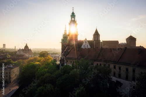 Soft lighted Wawel Castle at summer sunrise, Krakow, Poland
Wisible sun inside tower.
