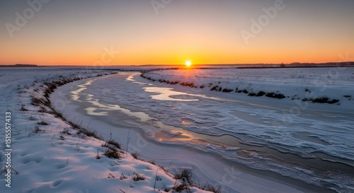 Serene Winter Landscape With A Partially Frozen River During Sunset