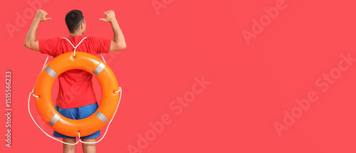 Handsome male lifeguard wit...