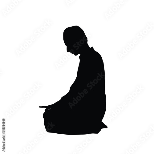 Silhouette of a Muslim man performing prayer, worship or salah