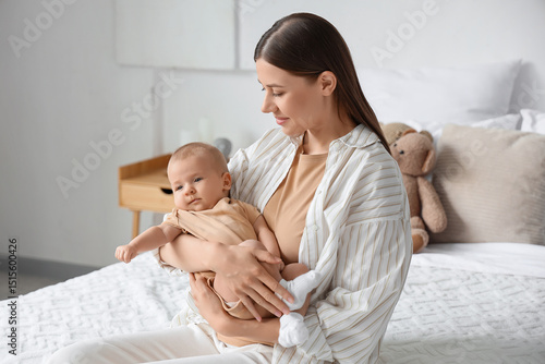 Happy mother with her littl...
