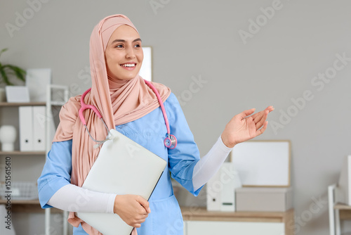Female Muslim doctor with l...