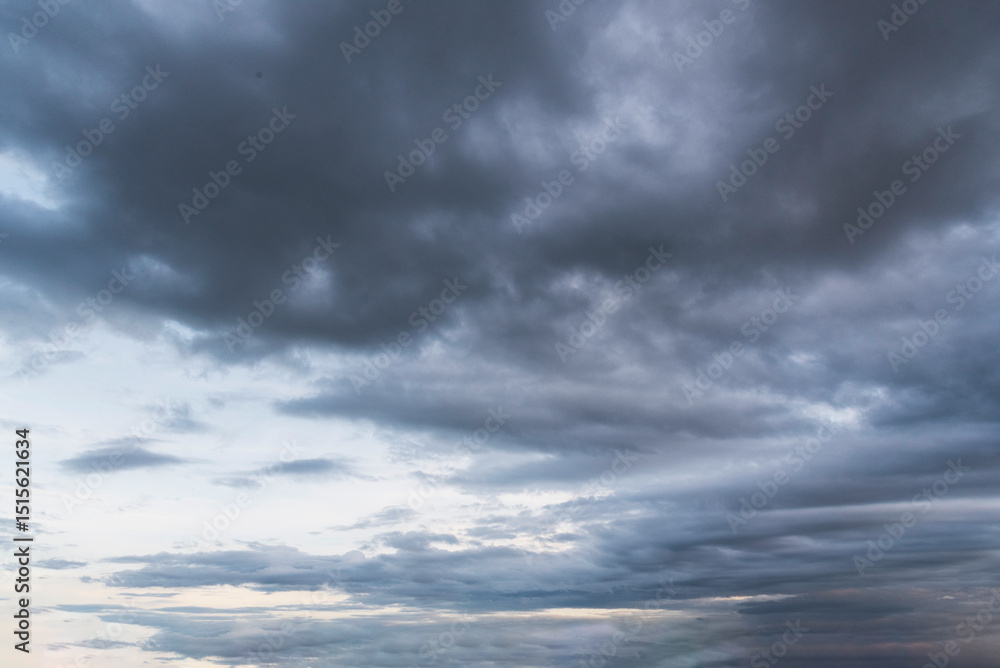 Fototapeta premium Dramatic dark storm thundercloud rain clouds on black sky background. Dark thunderstorm clouds rainny landscape. Meteorology danger windstorm disaster climate. Dark cloudscape storm disaster gray sky