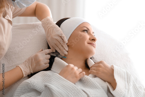 Female beautician giving in...