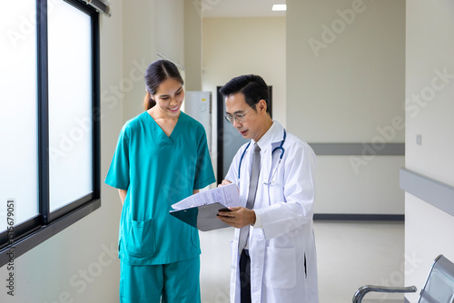 Team of Asian doctor is discussing and brainstorming on patient medical record after diagnosis for precise care plan with experienced senior physician specialist