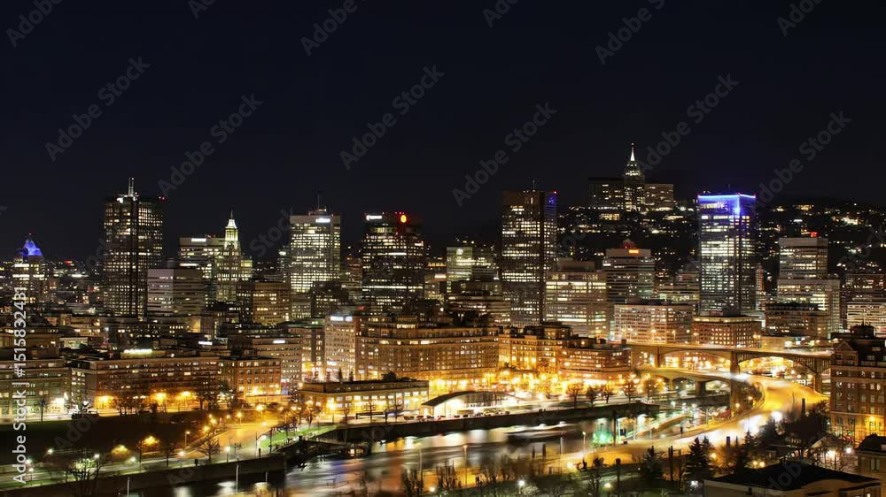 Vibrant city skyline at night with glowing skyscrapers and light trails from traffic along a river Vibrant city skyline at night with glowing skyscrapers and light trails from traffic along a river