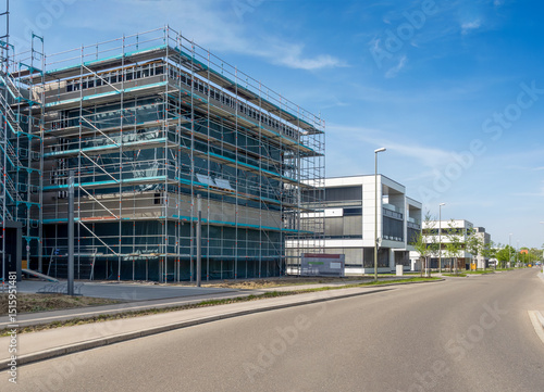 Modern industrial building with scaffolding in Augsburg, Bavaria