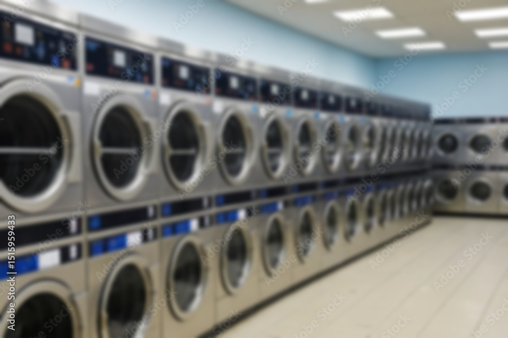general washing machine blur, washing machine and clothes dryer neatly lined up, without any people, laundry background blurry. general washing machine blur, washing machine and clothes dryer neatly lined up, without any people, laundry background blurry.