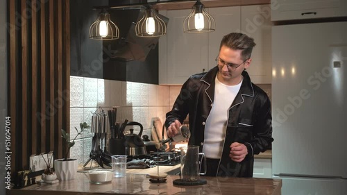 Experience the modern kitchen coffee making process with a trendy male barista, brewing coffee