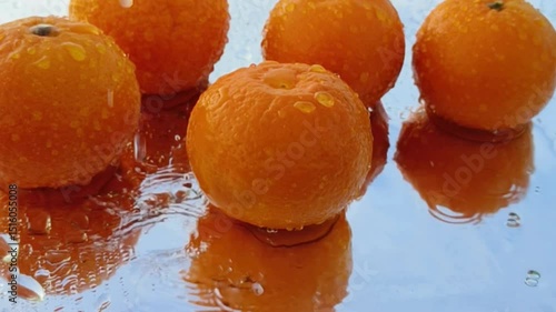 Orange with splash, drip and whirlpool. Makes a refreshing impression. Horizontal Video.