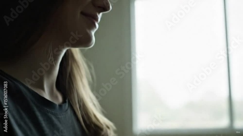 Medium shot showing the person and their laptop, an over-the-shoulder view of the screen (data can be blurred), a close-up of fingers typing on the keyboard, a shot of the person looking up to smile a