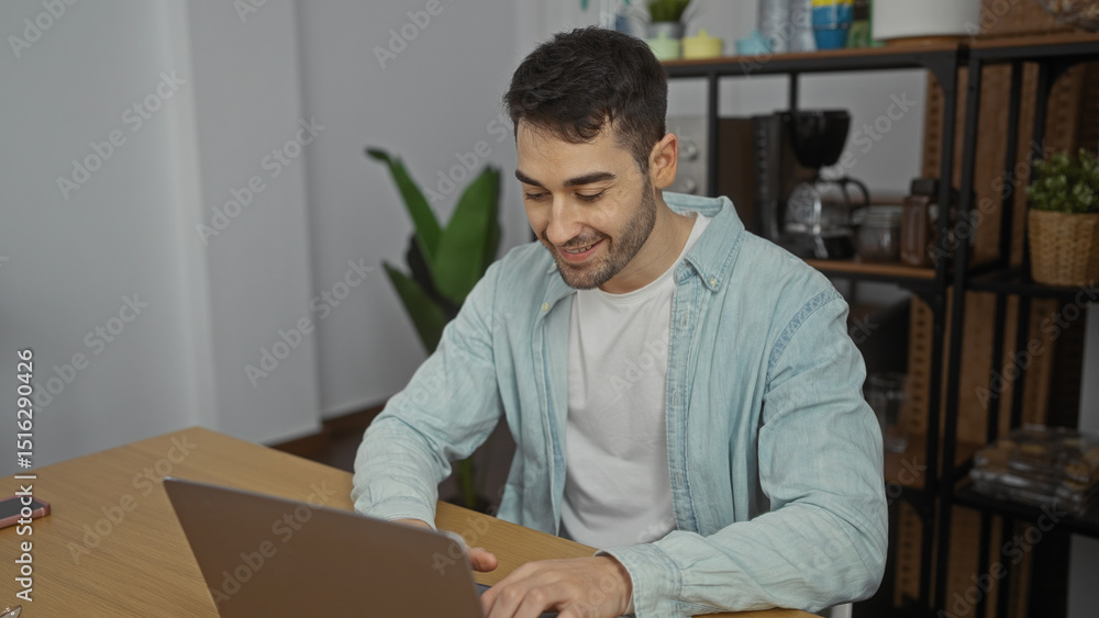 custom made wallpaper toronto digitalYoung hispanic man smiling while working indoors on laptop in office room with plants and wooden furniture, showcasing a productive and modern workplace setting